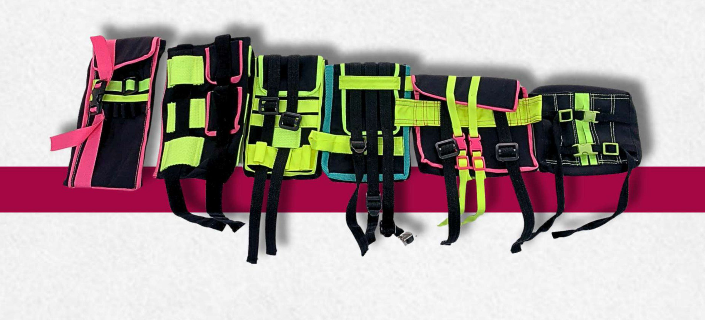 Six utility belts in black webbing with lime, pink and cyan straps